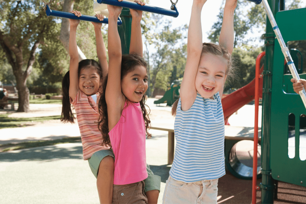 children on monkey bars using their fine motor skills