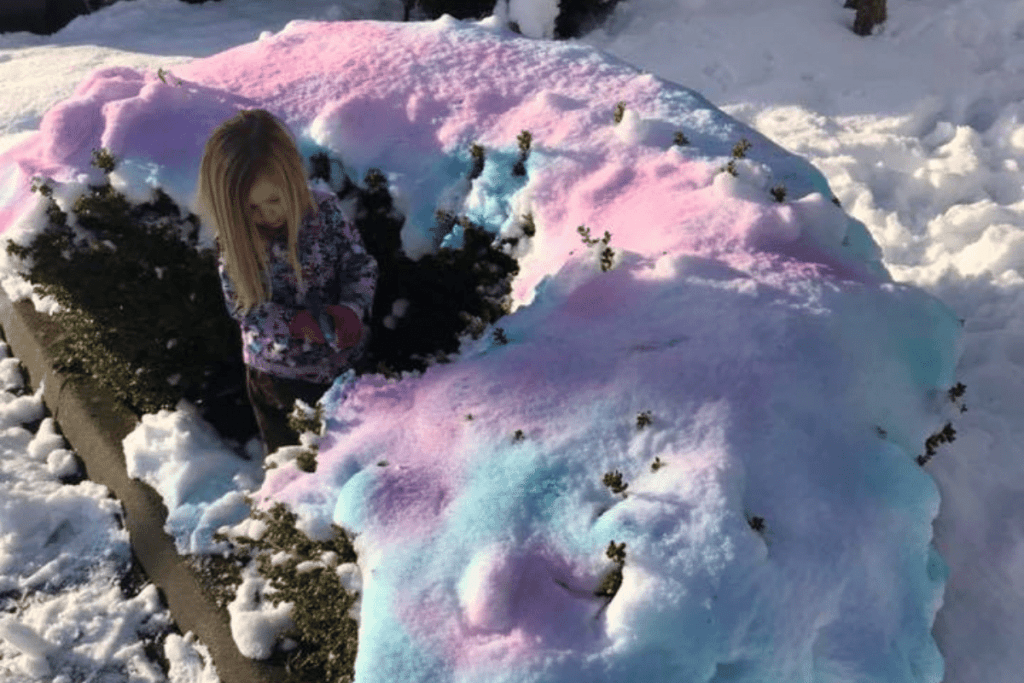 girl painting on the snow