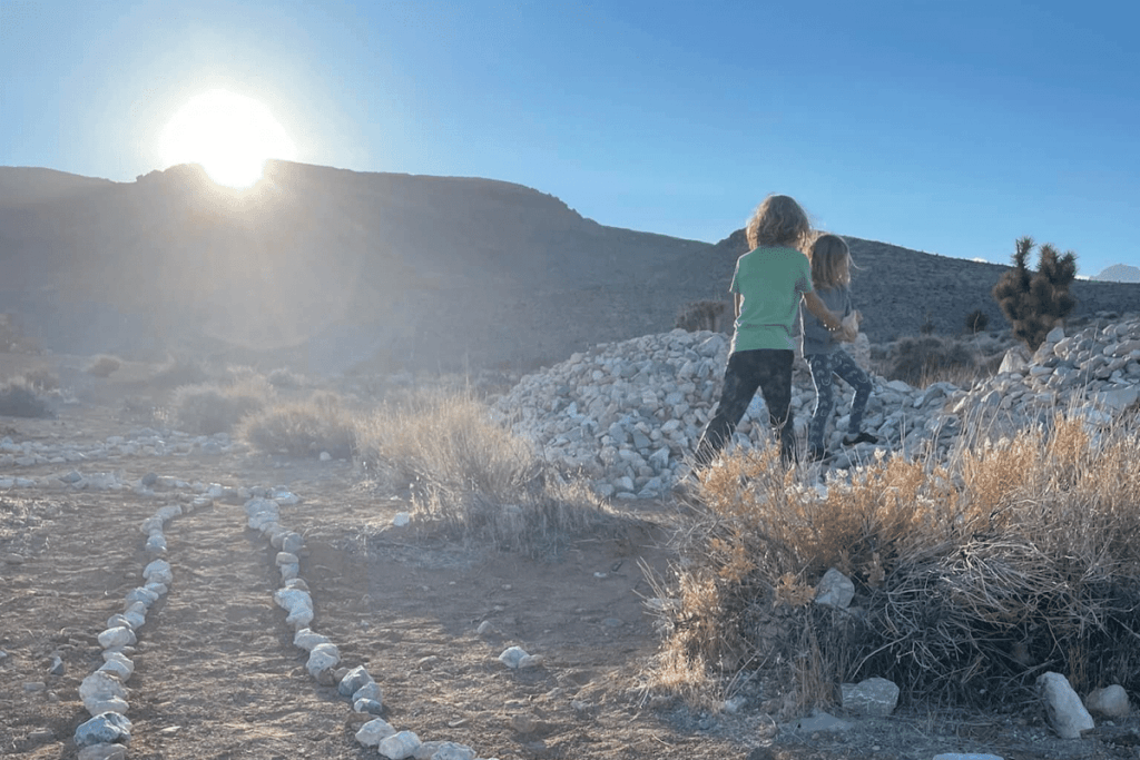 Kids Playing outside during the fall on a trail while the sun is setting